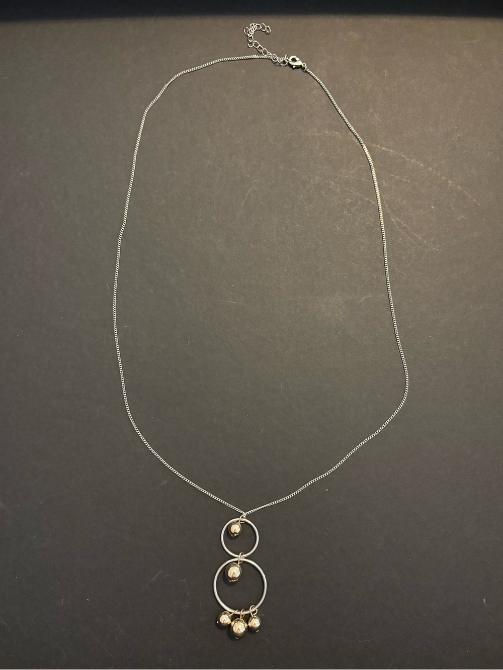 Delicate Silver Double-Ring Pendant Necklace with Bead Accents